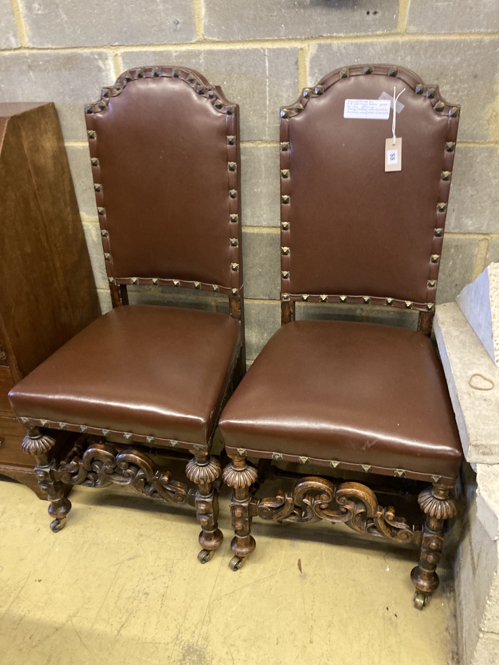 Two early 20th century oak Carolean design dining chairs by Waring & Son